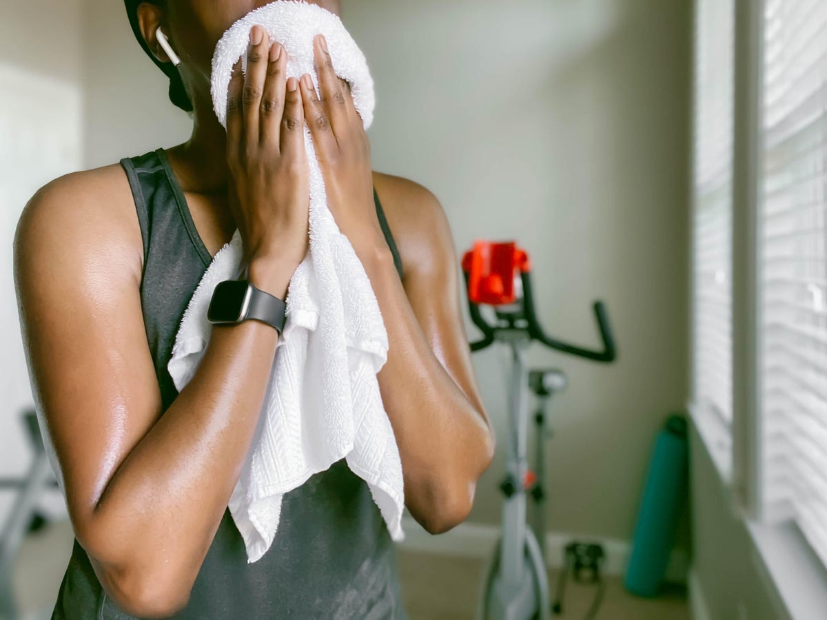 a woman wearing a towel over her face